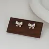 2025 Novo Tiktok Live Mais Vendido Versátil Exquisito Pequeno Laço Brincos Joias da Moda Atacado