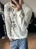 Camiseta unisex de manga larga con cuello redondo y estampado moteado estilo punk americano, hombros normales, corte ajustado como capa base, atuendo de pareja, top versátil