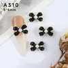 Joyería de red para arte de uñas, estilo pequeño y fragante de moda, perla de gota de aceite, lazo, accesorios de joyería de aleación para uñas en blanco y negro, venta al por mayor