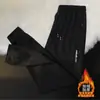 Calça esportiva casual masculina de inverno com forro de fleece, nova, moderna, de corte solto, com bolsos, zíper, estilo jogger, calça de moletom longa reta