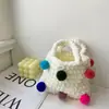 Ins hecho a mano tejido de ganchillo bola de pelo colorida para niños niña bolso de mano portátil accesorios bolsa para monedas de móvil venta al por mayor