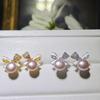 S925 nuevos pendientes de perla con lazo pendientes al por mayor versión coreana de circonita gota de aceite lazo chica dulce