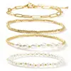 Pulsera de cruz de perlas chapada en cobre transfronteriza europea y americana más vendida, moderna, casual, versátil, joyería apilable multicapa para mujer