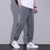 Pantalones de seda de hielo para hombre de verano estilo delgado moderno combinable pantalones casuales holgados deportivos de secado rápido harem leggings de nueve puntos