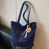 Bolsa de mano tipo tote simple de estilo coreano al por mayor para mujer 2025 Verano Nuevo Gran Capacidad Hombro Único Lona Versátil Bolso de Axila