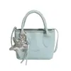Comercio Exterior Estilo Coreano Lujo Ligero Bolso de Cubo Portátil para Mujer Bolso de Hombro Simple Elegante Nuevo Verano 2026 Bolso Cruzado para el Trabajo