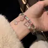 Pulsera con Colgante de Campana y Cuerda Rosa Estilo Gatito para Mujer, Pulsera con Campana de Diseño Juvenil Elegante