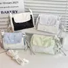 Bolso de mano de tres capas con estampado de estrellas altamente atractivo y gran capacidad, adecuado para maquillaje, cámaras instantáneas y teléfonos móviles