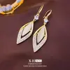 Elegantes Ganchos para Oreja de Rombo Incrustados de Diamantes Estilo Cat-Eye Pendientes de Borla Larga de Lujo Accesible Francés Pendientes de Gama Alta Elegantes de Nicho para Mujer