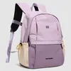 Mochila de estudiante para el día a día con bloqueo de color estilo dopamina transfronteriza, mochila ligera de gran capacidad para viajes al aire libre para mujer