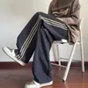 Pantalones deportivos estilo americano de verano transfronterizos, corte holgado, ligeros, con tres rayas, nuevo tejido de seda helada de secado rápido, pantalones casuales de pierna ancha para hombre