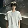 Camiseta básica simple bordada de manga corta, disponible en varios colores, con corte raglán, ajuste holgado y cuello redondo, adecuada para adolescentes