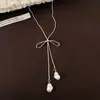 Collar largo ajustable con colgante de lazo estilo ins coreano para mujer, nuevo accesorio popular de cadena para el cuello 2026, cadena para la clavícula