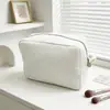 Bolsa de maquillaje con patrón de gofre, superventas transfronterizo de Etsy, bolsa de almacenamiento de viaje portátil de gran capacidad, neceser de color sólido de alta apariencia
