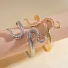 Pulseira aberta geométrica em formato de cobra de metal criativa europeia e americana, anel de braço personalizado de alta qualidade para cross-border, joias de nicho ins para mulheres