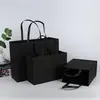 Bolsa de mano de papel kraft personalizada de fábrica, tarjeta blanca, bolsa de compras para ropa, tarjeta negra personalizada, estampado en bronce, bolsa de regalo UV