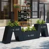Caja de flores de acero inoxidable para exteriores combinación soporte de flores de hierro departamento de ventas valla de plantación verde partición canaleta para flores cama de flores exterior de restaurante