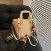 Moda de Primavera Bolso de Mano para Mujer Bolso Tote Pequeño 2026 Nuevo Bolso Cubo Simple Versátil Bolso Cruzado para Hombro para Teléfono