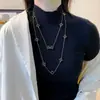 Colección Larga de Collares Superpuestos de Perlas Swarovski para Mujer, Estilo Lujo Ligero, Cadena Versátil para Suéter con un Toque de Alta Gama, Venta al por Mayor Otoño e Invierno