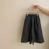 Conjunto de tres piezas de otoño 2026 para niña, estilo coreano, top de manga larga simple y versátil con tirantes, pantalones casuales elegantes