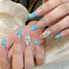 Shein Suministro Arte de Uñas Estilo Francés Puntas de Uña Portátiles Producto Terminado con Flores Talladas 3D Transparente Hielo, Líneas Azules y Uñas Postizas Color Nude