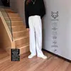 Nuevos pantalones versátiles de color liso de pierna recta con forro polar engrosado para otoño e invierno 2025 para hombre, pantalones casuales de negocios con caída y sin arrugas