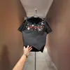 Camiseta Estampada Floral Bordada de Manga Curta Estilo Americano Tendência para Homens e Mulheres, Novo Popular de 2026 Top Soltinho de Meia Manga para Casal