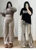 Jeans acampanados retro estilo americano talla extra para mujer con diseño de patchwork de dobladillo sin rematar, pantalones bootcut adelgazantes