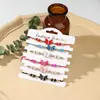 Pulsera tejida de aleación con cuentas de cristal de mariposa de venta caliente transfronteriza, pulsera de cuerda para la mano todo en uno para viajes, vacaciones, pareja, en stock