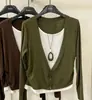 Camiseta de manga larga de color liso estilo coreano, una nueva colección de otoño con corte holgado, efecto adelgazante y diseño versátil, disponible en tallas grandes para mujer