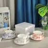 Taza y platillo de porcelana de hueso estilo europeo transfronterizo Serie Tigre Ruyi Juego para el hogar Taza de café y platillo Caja de regalo creativa para café de la tarde