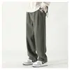 Pantalones casuales rectos de primavera, nuevos pantalones anchos sencillos de color liso para hombre, pantalones largos holgados y a la moda que combinan con todo.