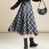 Elegante falda de cuadros para mujer, nuevo estilo otoño e invierno 2026, de cintura alta, falda de línea A adelgazante, falda versátil de dobladillo grande irregular