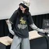 Conjunto de dos piezas estilo caricatura para niñas Zhongda primavera y otoño 2026, sudadera de otoño para niños, capa base moderna para la vuelta al cole