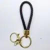 Venta al por mayor del fabricante Llavero de Cuerda de Aleación Tejida y Cuero Accesorios Colgantes Material PU Bolsas Pequeñas de Regalo Accesorios para Llaveros