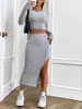 Ropa de Mujer Transfronteriza Europea y Americana Otoño e Invierno 2026 Nuevo Conjunto de Falda Casual de Color Sólido Ajustado con Cuello Redondo y Manga Larga con Abertura Lateral