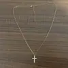 Exquisita cadena de cruz simple para damas de acero inoxidable chapada en oro real de 18K micro incrustada mini collar de cruz de circonita cúbica CZ para mujer