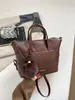 Bolso tipo cubo de diseño coreano de nicho, a la vanguardia del diseño, para mujer, nuevo lanzamiento verano 2026, bolso de mano, bolso cruzado, bolso de hombro simple para el día a día