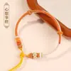 Pulsera de hebilla de paz cuerda trenzada producto semiacabado hecho a mano se puede usar como flor de solapa cuentas de transferencia doradas año zodiacal pulsera de cuerda roja para mujer