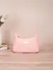 Bolso de axila nuevo estilo japonés y coreano 2025 con relieve de patrón de ondas de moda, adecuado para mujeres para ir de compras y al trabajo