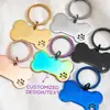 Llavero de Pata de Hueso Hueco de Acero Inoxidable Etiqueta/Colgante de Gato Bidimensional de Acero de Titanio Patrón Geométrico Colorido