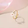 Diseño de Nicho Europeo y Americano Exquisito Anillo Abierto de Acero Inoxidable con Flor y Perla Chapado en Oro de 18K Anillo Abierto al por Mayor