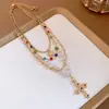 Colar pingente de cruz solar com pérolas cravejadas de diamantes, gargantilha da moda para a clavícula, acessório de luxo leve de alta qualidade