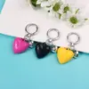 Nuevo llavero decorativo multicolor de resina con forma de corazón para llaves de coche, versátil y creativo.