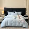 Juego de cama de lujo y elegante de cuatro piezas 100% algodón de fibra larga de Xinjiang, hecho completamente de algodón puro, con diseños florales y bordados de alta gama, adecuado para madres y bebés