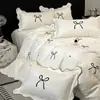 Juego de cama de cuatro piezas de encaje fresco de lujo ligero estilo francés con bordado de lazo, ropa de cama estilo princesa color crema