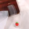 Bonito cepillo para el pelo de fresa de dibujos animados, peine pequeño transparente con purpurina para el hogar, cepillo portátil de alta estética para el cuero cabelludo