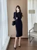 Vestido de punto de alta gama para mujer en Shenzhen, nuevo para otoño e invierno, falda suéter ajustada al cuerpo de manga larga, color azul zafiro