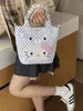 Bolso de mano Hello Kitty para mujer 2026 nuevo bolso tipo cubo de dibujos animados con un toque de alta gama, adecuado para ir al trabajo, bolso de hombro y cruzado de lunares