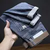Jeans masculinos de primavera 2006 novo estilo coreano moderno de alta qualidade stretch slim-fit calças compridas calças casuais lavadas